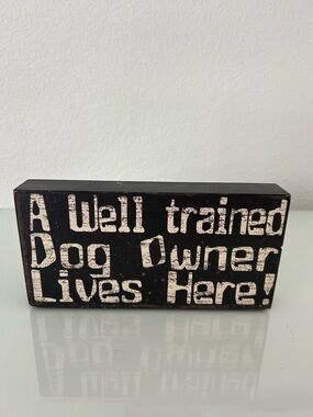 A Well Trained Dog Owner Lives Here!
Wooden block/sign